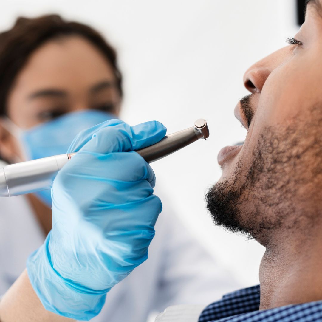 Man in dental chair with doctor
