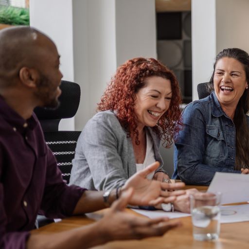 Group of people at a table laughing