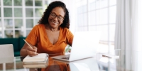 Person watching a webinar on her computer