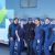 Group of people in front of mobil dental clinic