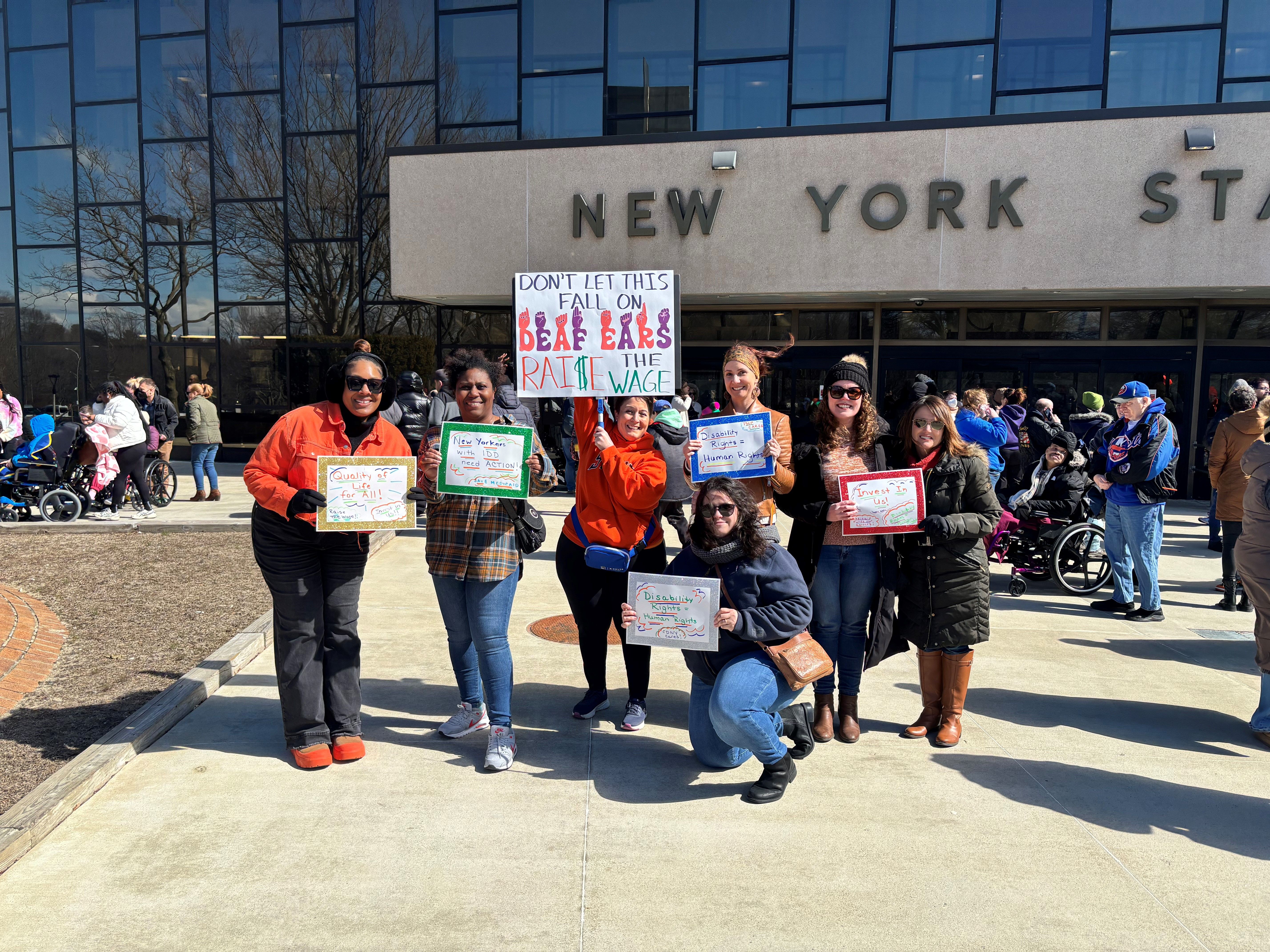 members of PHP team in front of New York State building for Rally event