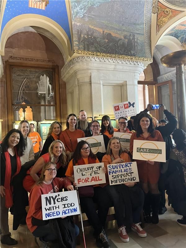team members from PHP holding signs at NYDA rally