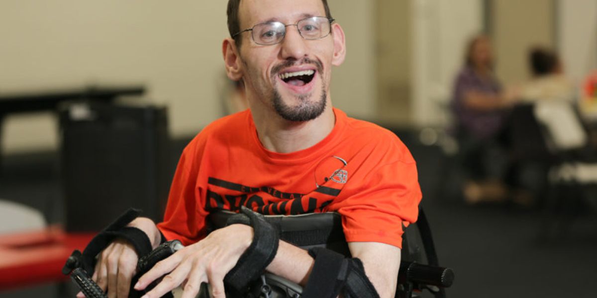 Man in a wheelchair smiling