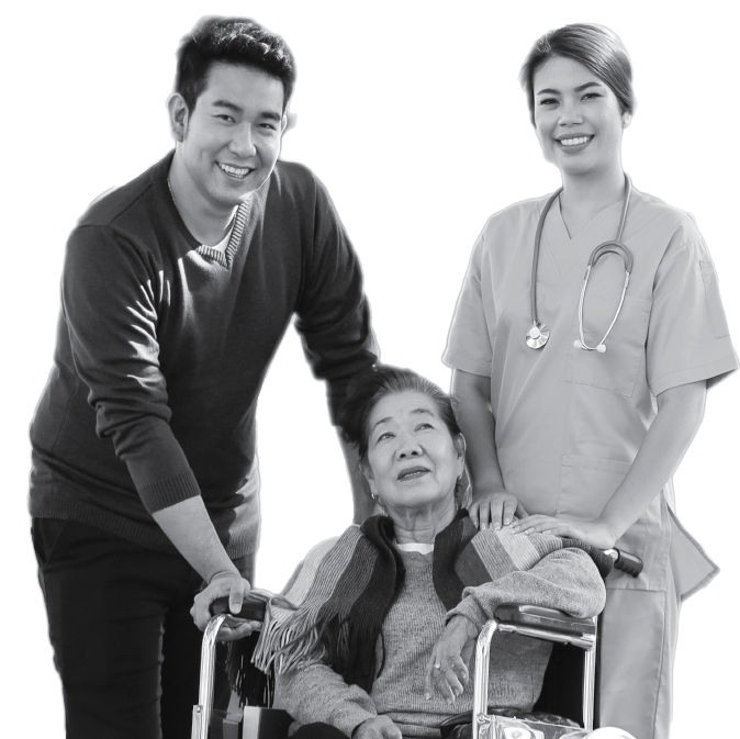 Man and woman standing behind older woman in wheelchair.